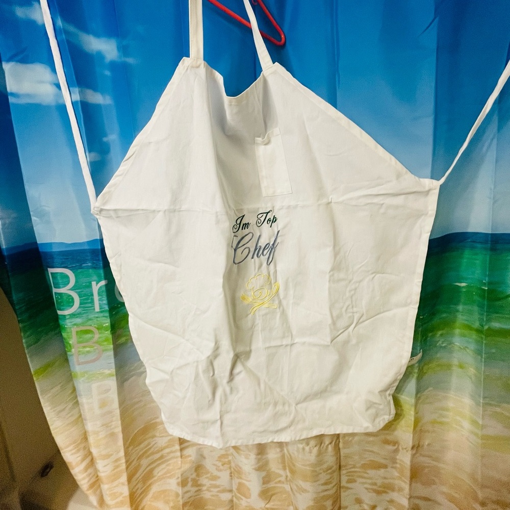 White apron with embroidery on it